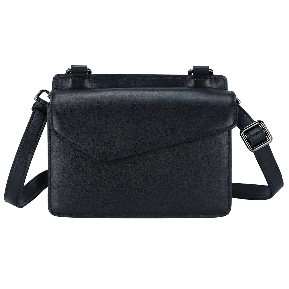 Black genuine cow leather designer crossbody bag with a minimalist flap and adjustable shoulder strap.