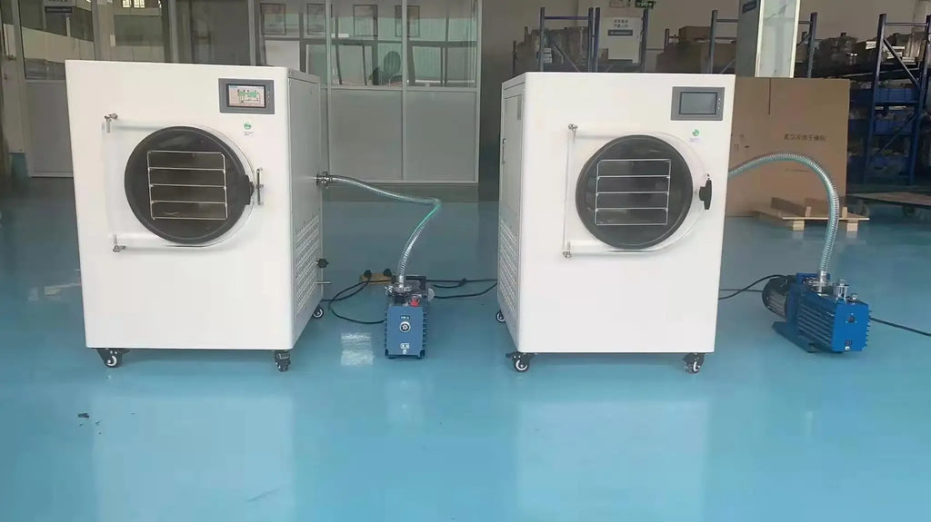 Pair of industrial printing/labeling machines with large fan vents and control panels