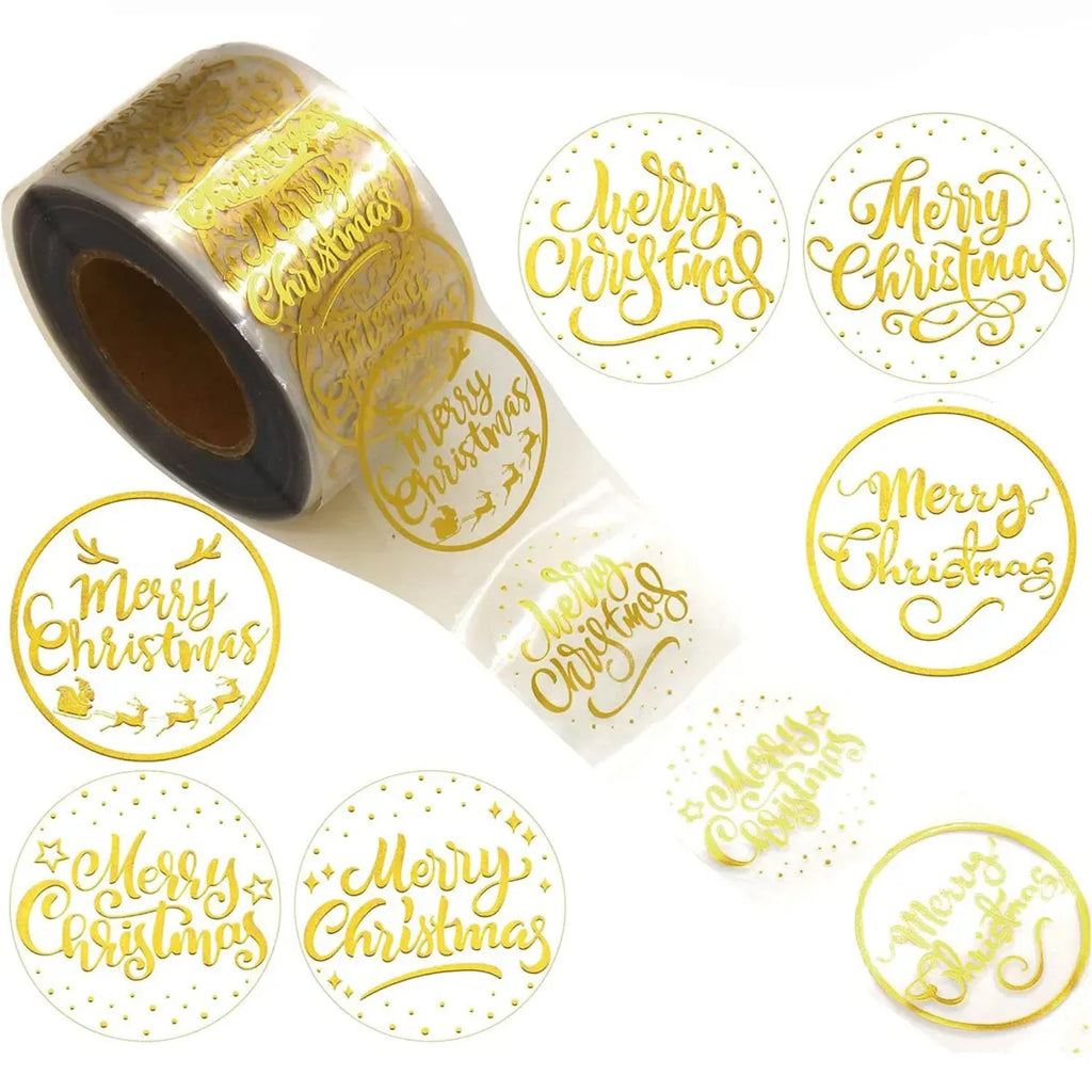 Roll of round Merry Christmas stickers with gold text and border, transparent adhesive finish.