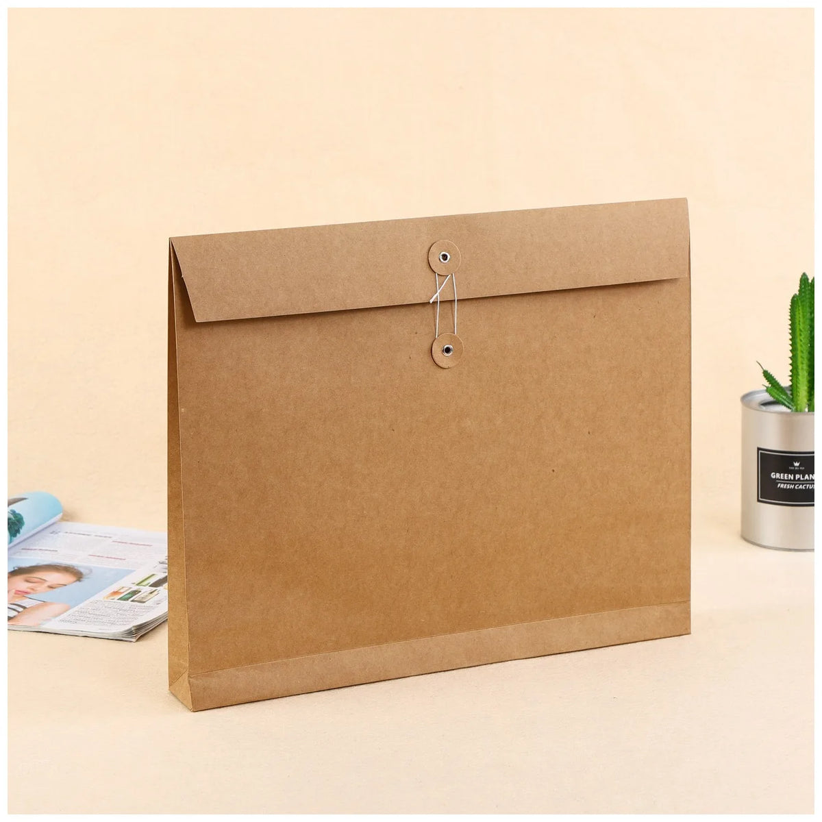 Brown kraft paper mailing pouch with metal snap-button tab, flat-bottom design