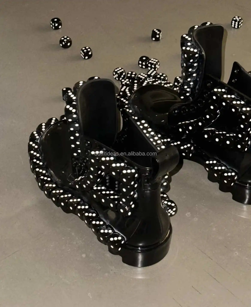 Black luxury leather platform loafers embellished with 3D dice, featuring a thick lug sole in a unique avant-garde style.