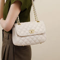 Beige quilted genuine leather shoulder bag with gold chain strap and metal turn-lock flap closure.