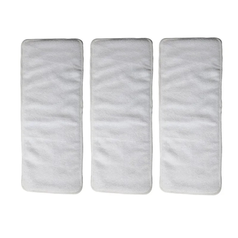 Three white, absorbent microfiber cloth diaper inserts for reusable baby care.