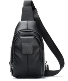 Black genuine leather designer sling bag for women with an adjustable shoulder strap and front zippered pocket.