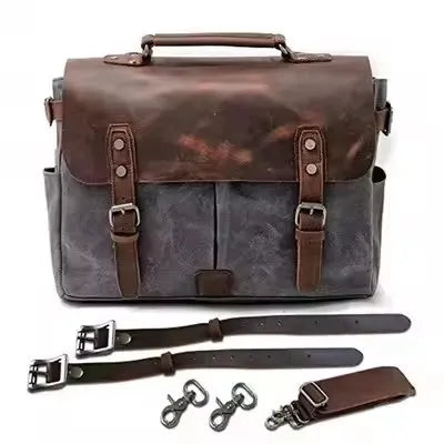 Grey oil wax canvas motorcycle saddle bag with brown crazy horse leather trim, buckles, and adjustable shoulder straps.