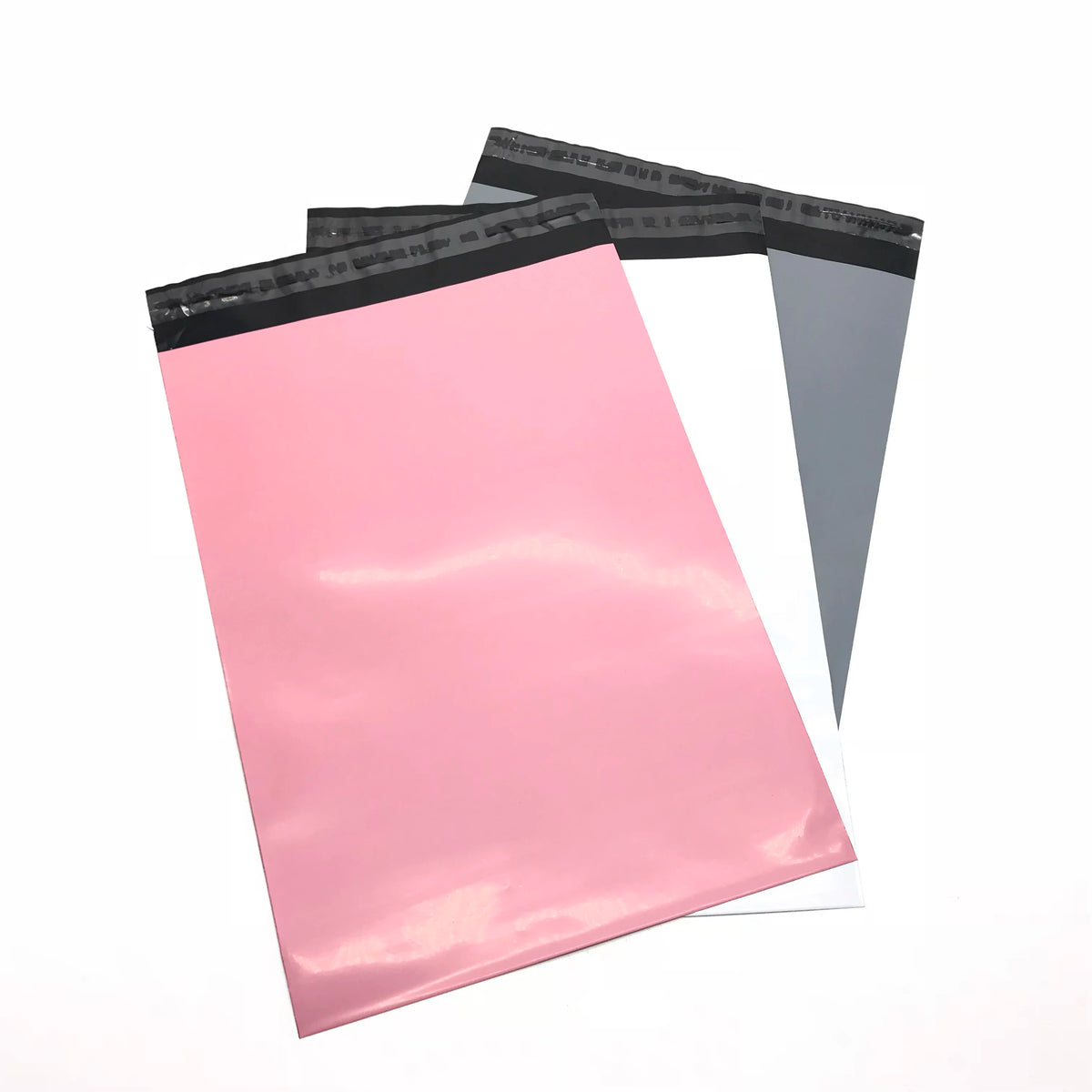 Pink and dark gray poly mailing bags with black top strip