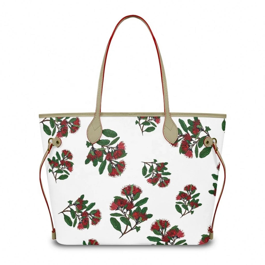 Designer leather tote bag with white floral Ohia Lehua print, tan straps, and large capacity for daily luxury.