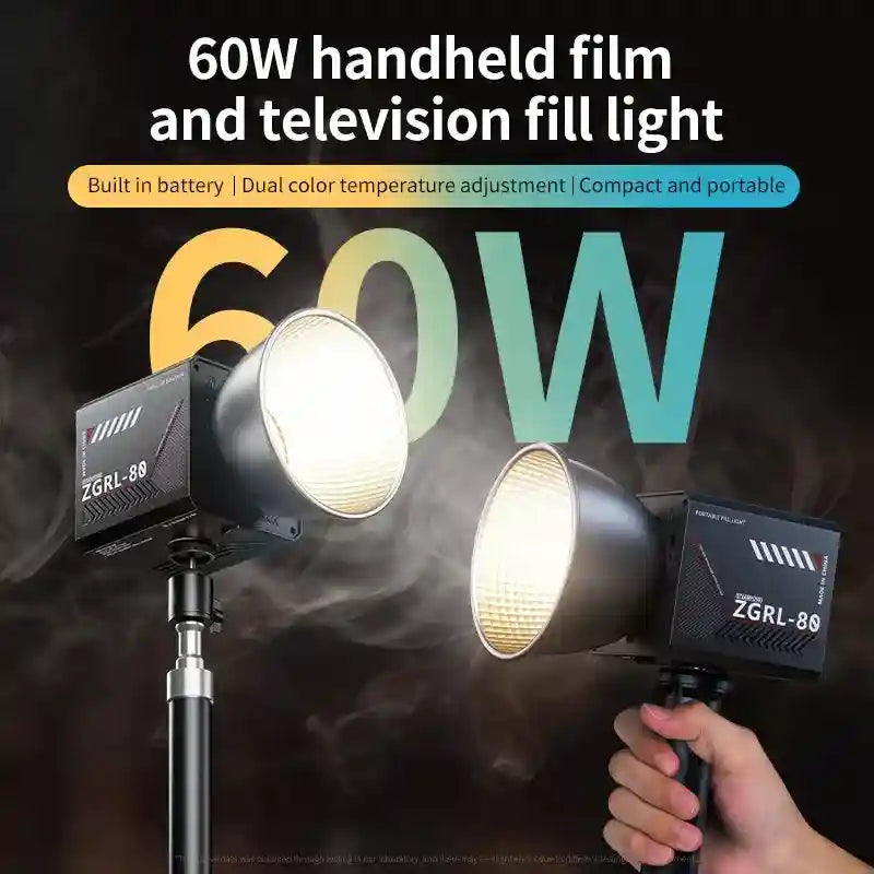 Portable 60W LED fill light with a black rectangular housing, metallic reflector, and handle for video production.