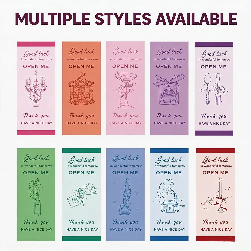 Sheet of multiple “Good luck” “OPEN ME” rectangle seal stickers in various colors