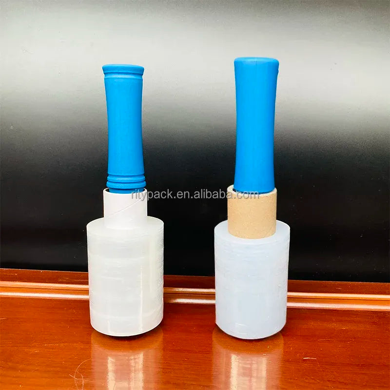 Two clear BOPP packaging tape rolls standing upright for packing and sealing.