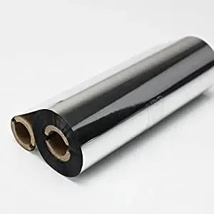 Black thermal transfer ribbon rolls with brown cores, close-up