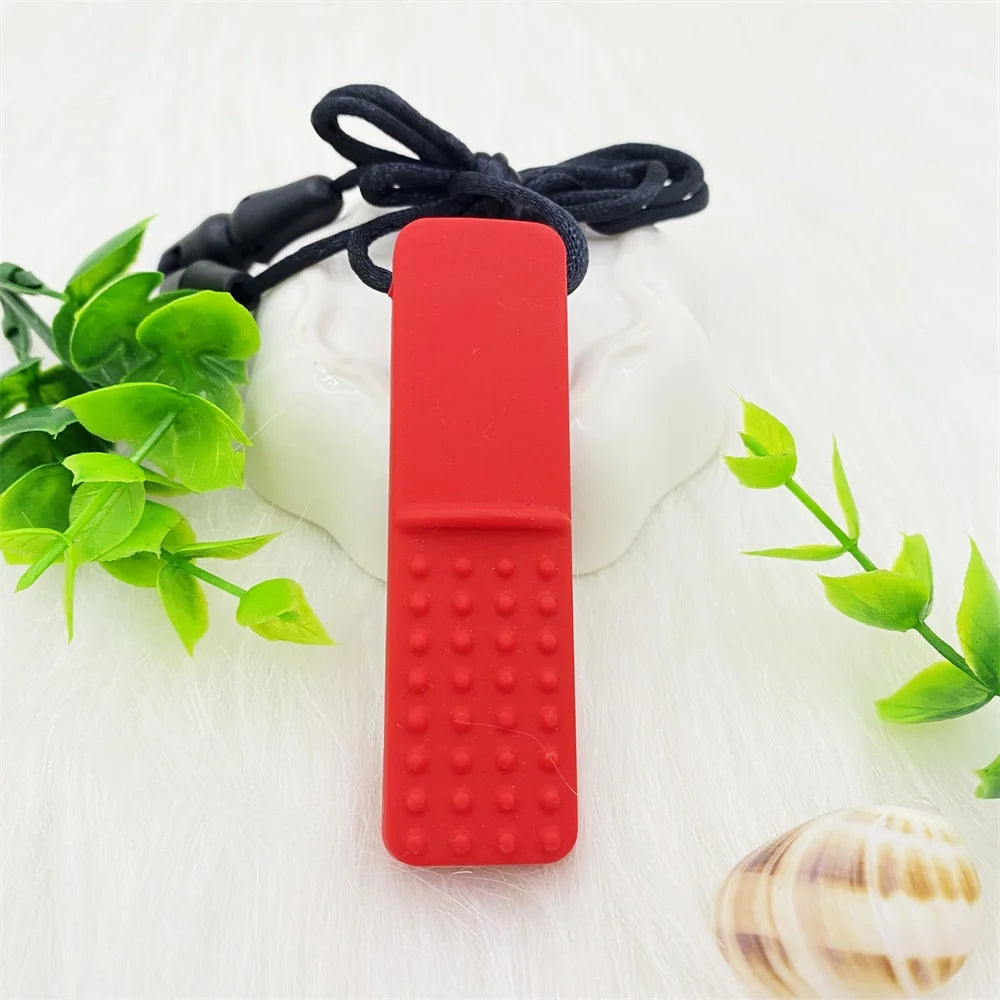 Red silicone teething toy for baby relief on a cord.