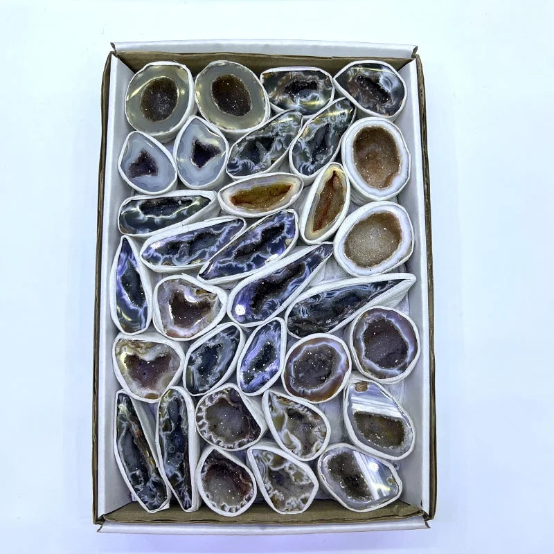 Agate geode crystal slice assortment in a gift box with varied dark gray stones