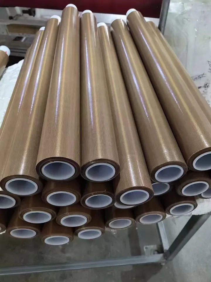 Stack of brown heat-sealing tape rolls with white inner cores