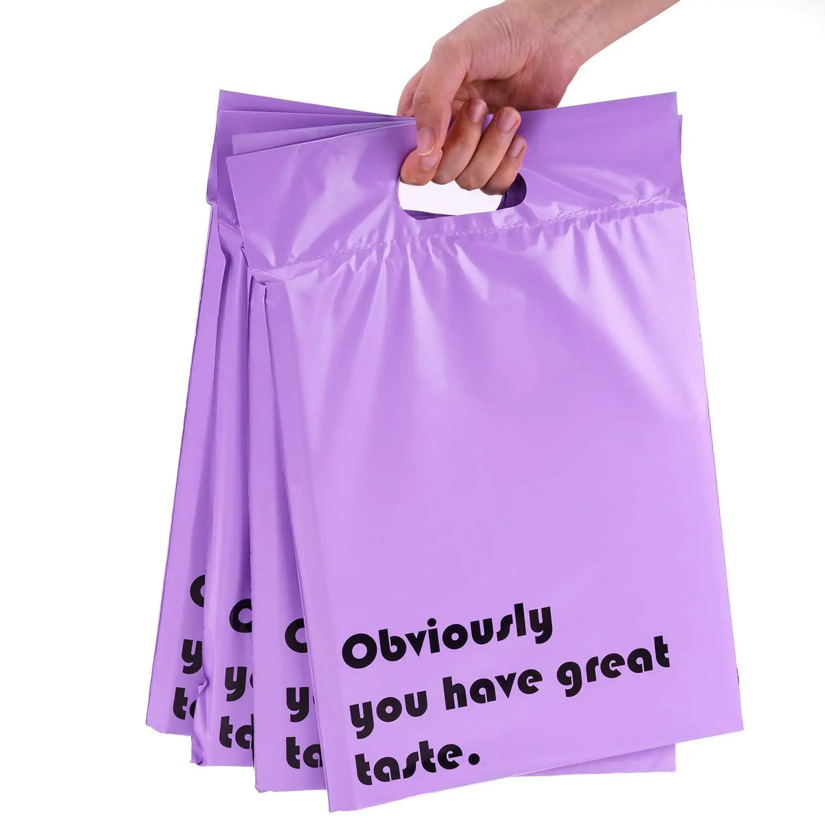 Purple custom printed poly mailing bags with handle, stacked with black slogan graphic