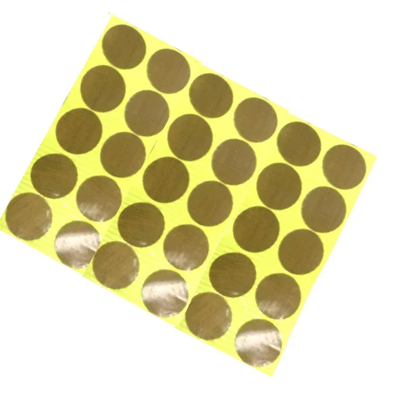 Brown heat-resistant adhesive tape sheet with circular dots on yellow release backing