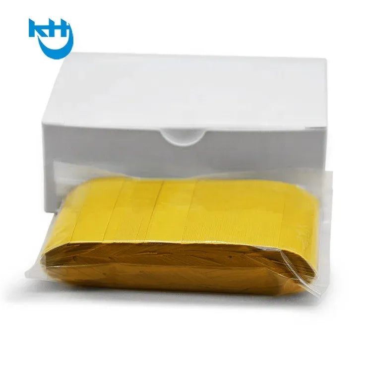 Yellow splice tape strip in clear plastic packaging