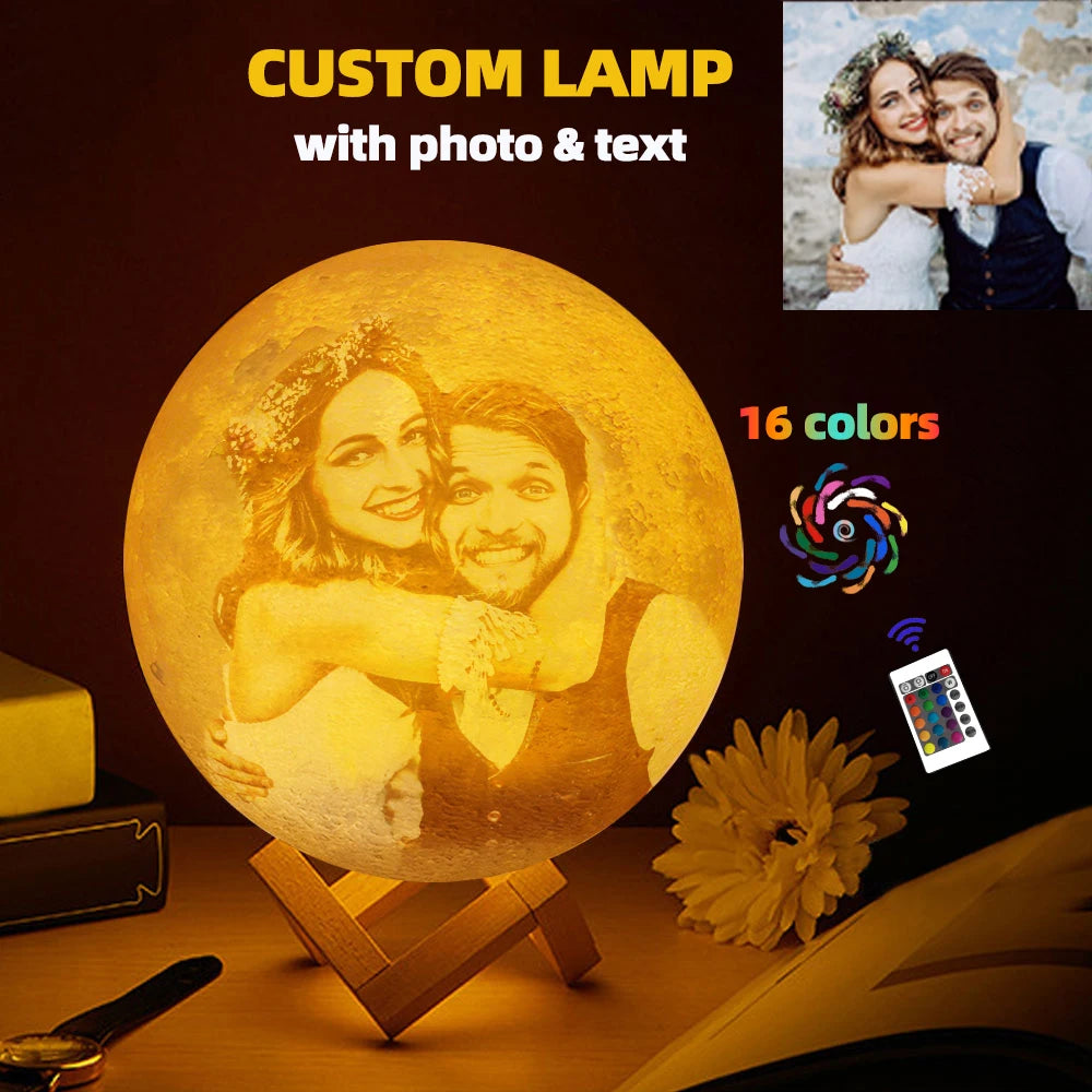 Custom moon lamp with a personalized couple photo, featuring 16 color settings and a remote control on a wood stand.