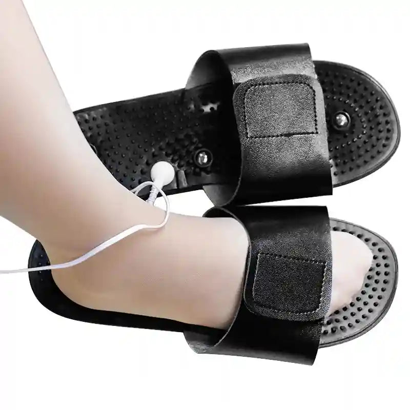 Black reflexology acupuncture massage slippers with electric stimulation cord for stress relief and foot relaxation.