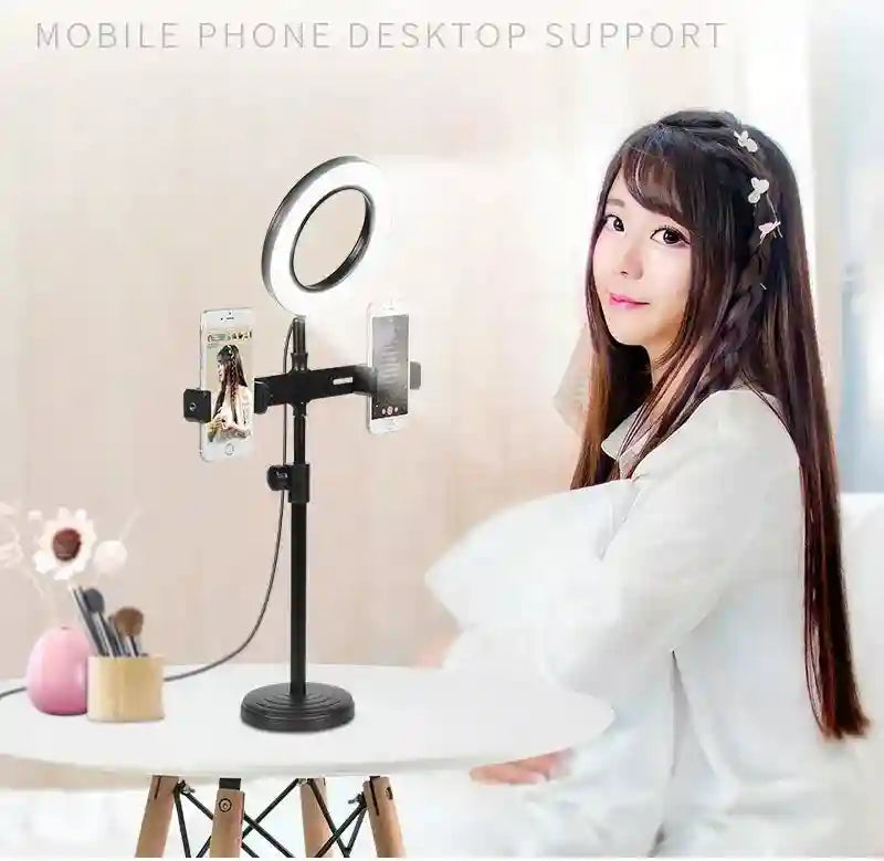Black desktop phone stand with a ring light and two adjustable side phone mounts for recording and video calls.