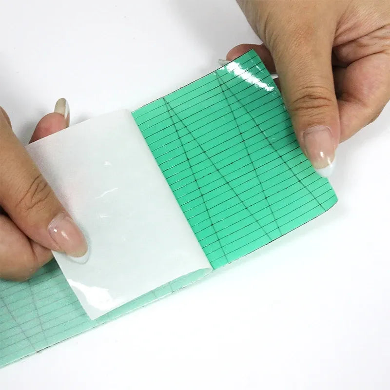Green waterproof membrane tape with grid backing, partially applied on a surface