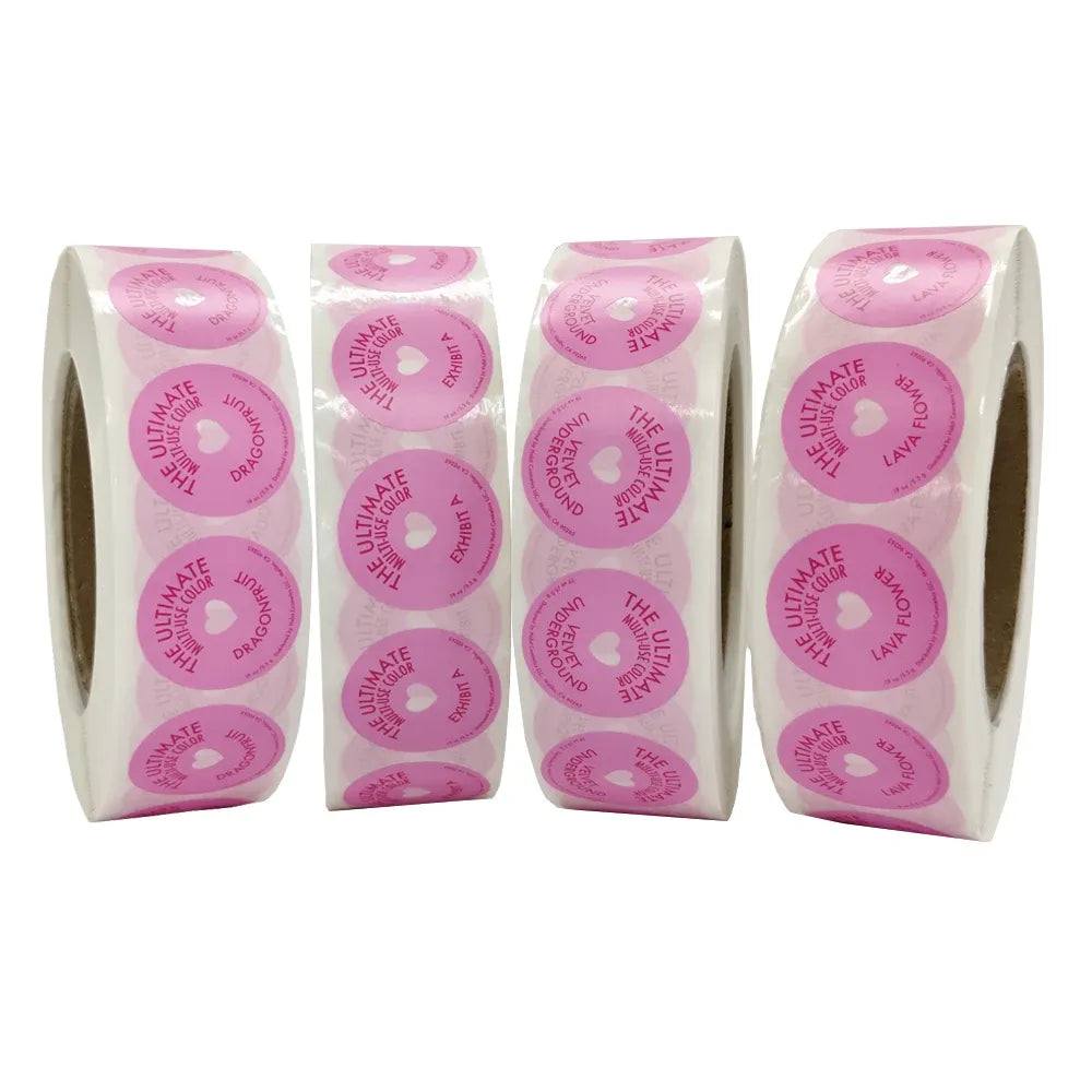 Strip packs of pink round adhesive labels with repeated circular print