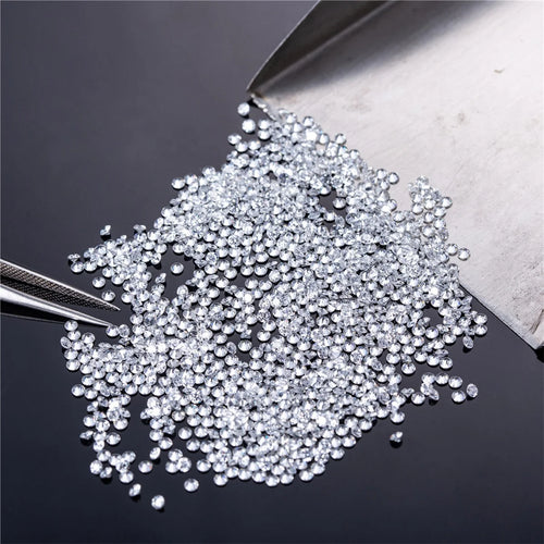 Loose round brilliant lab-grown diamonds, glittering micro stones in a pile