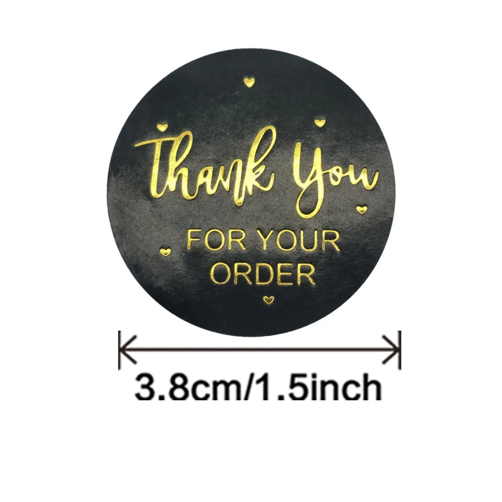 Black round “Thank you for your order” sticker, gold lettering and hearts, 3.8cm size