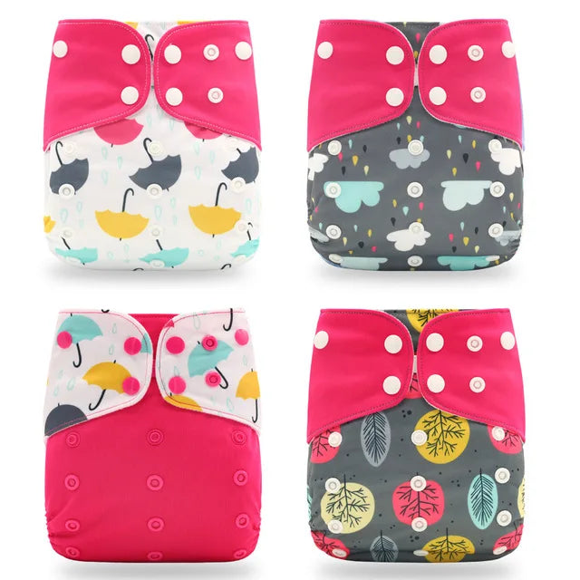 Set of 4 reusable baby cloth diapers with snap closures, featuring colorful umbrella, cloud, and tree patterns.
