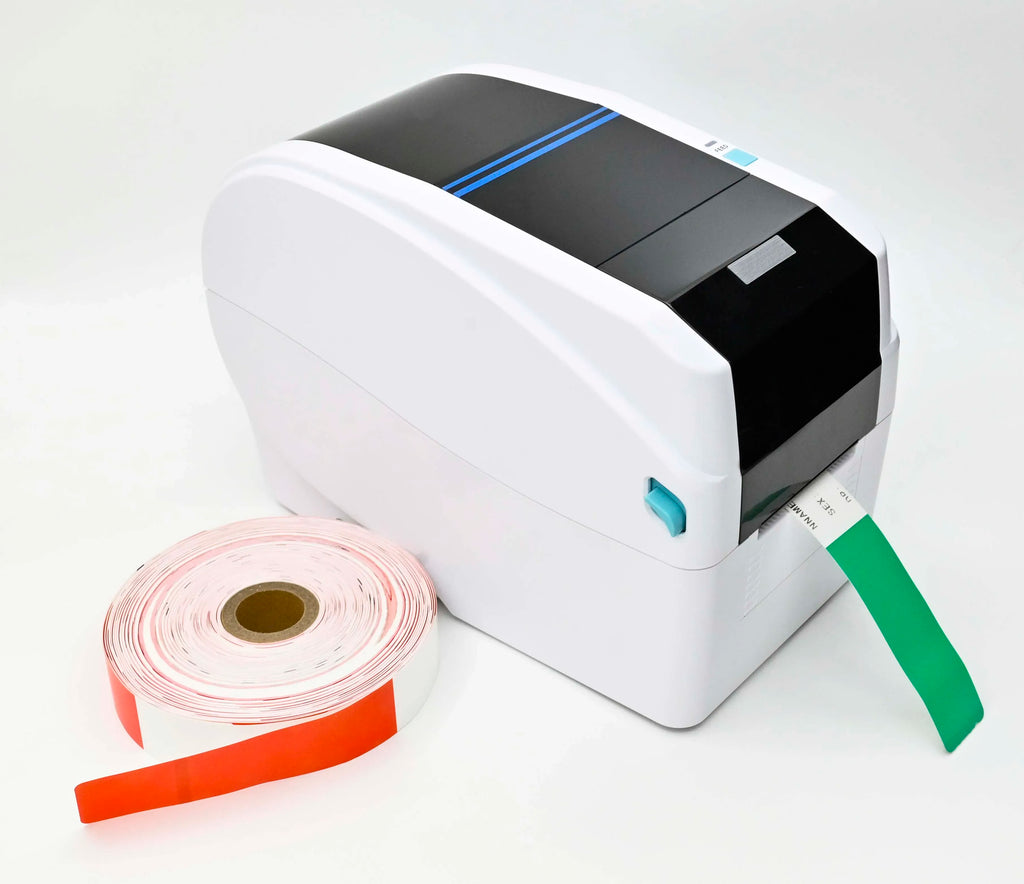 White desktop barcode printer with roll labels and green and pink label strips