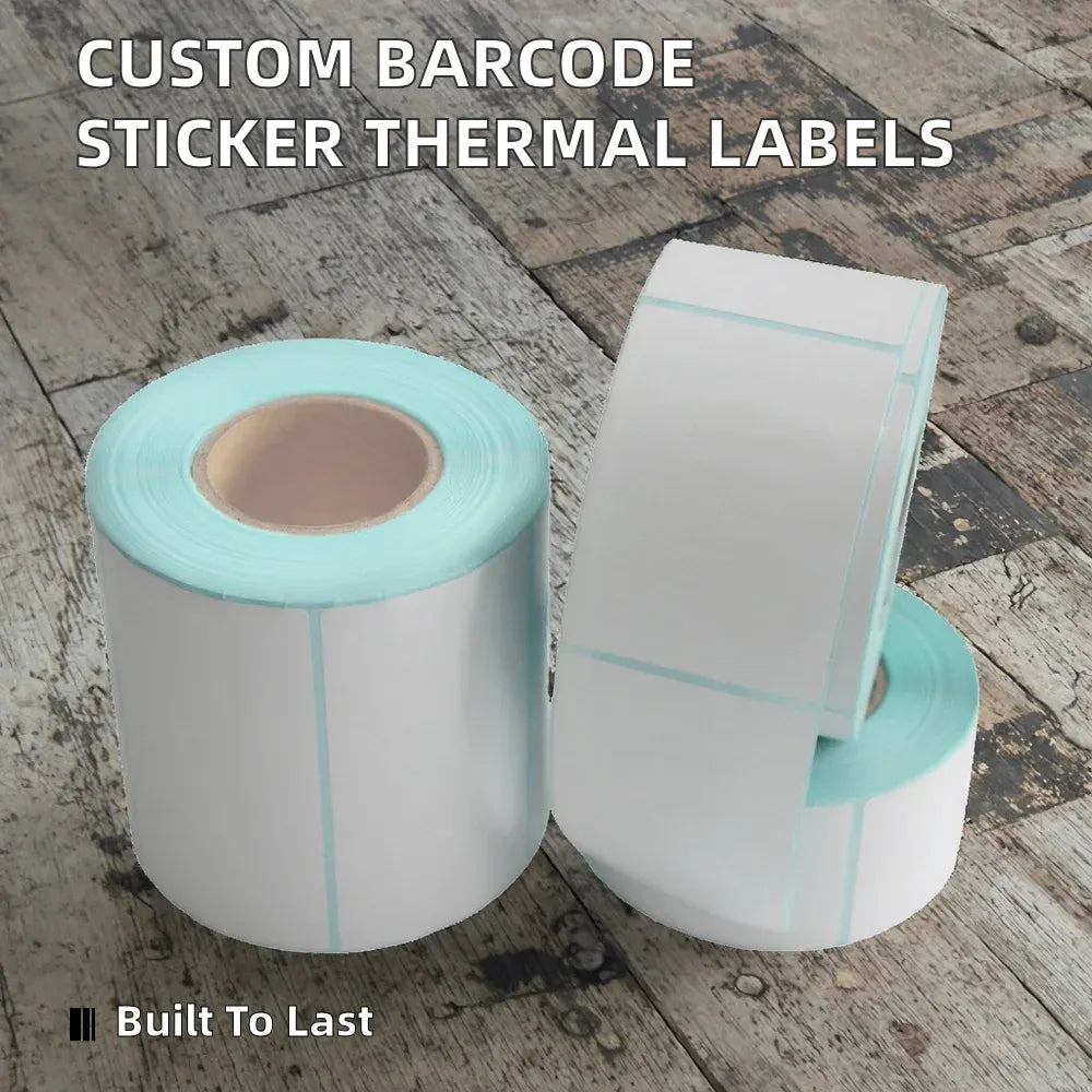 Thermal shipping label rolls, white labels with cyan borders and barcode strip edges