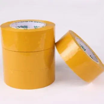 Yellow adhesive packing tape roll with loose tape end