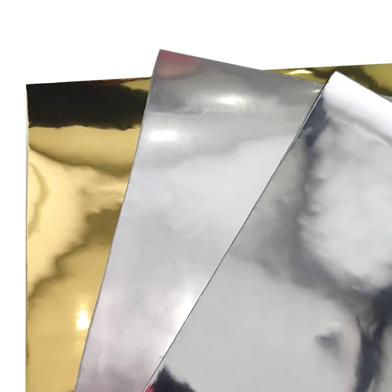 Metallic mirror reflective film layers in silver, gold, and dark reflective tones