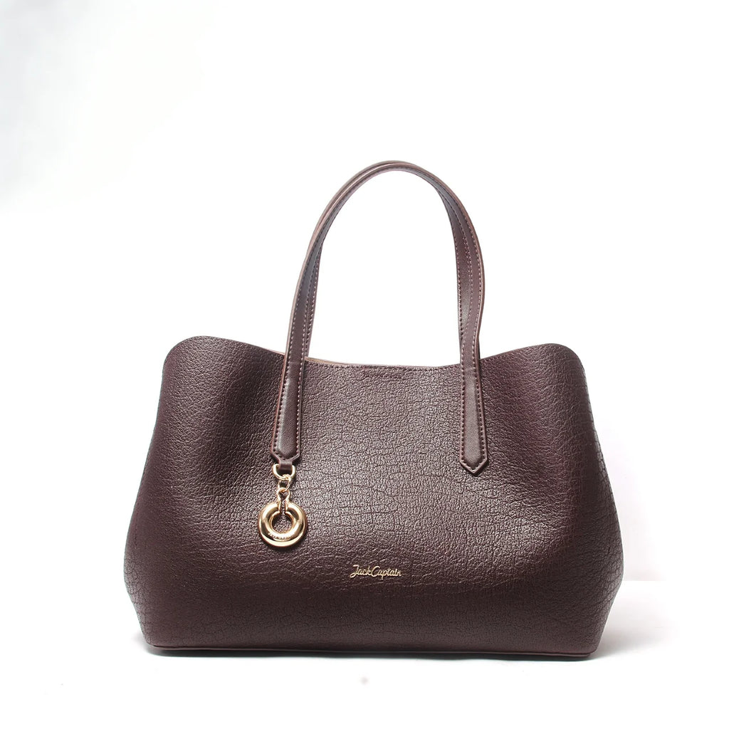 Dark brown pebbled leather Jack Captain designer tote handbag with gold logo charm and double top handles.