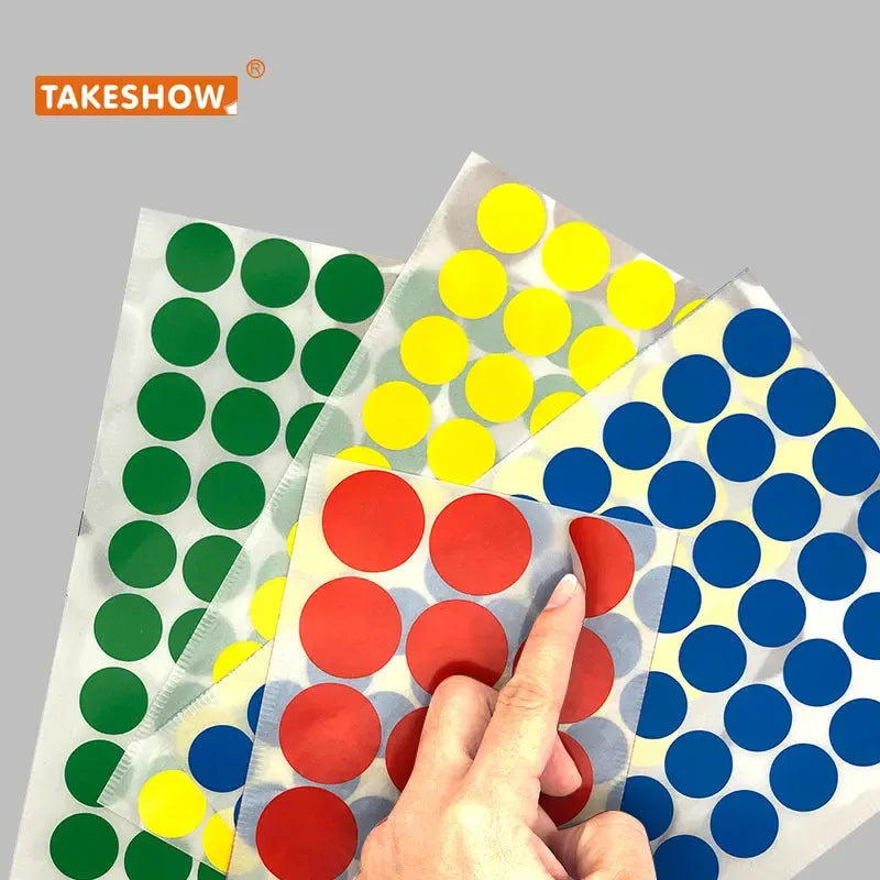 Assorted round dot sticker sheets in green, yellow, red, and blue