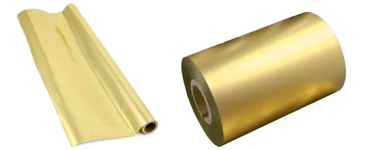 Matte gold wax ribbon jumbo roll and partially unrolled end for label printing