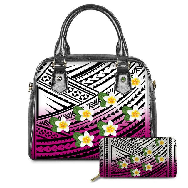 Polynesian tribal print leather handbag and wallet set in pink, black, and white with colorful plumeria flowers.