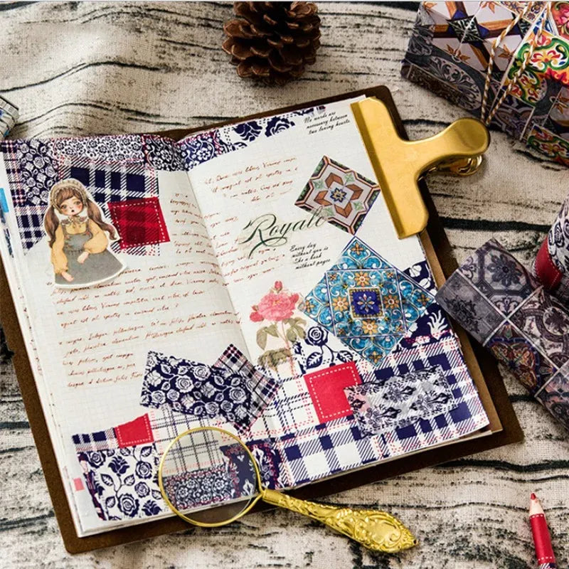 Decorative masking tape strips in blue, red, and white collage patterns on paper