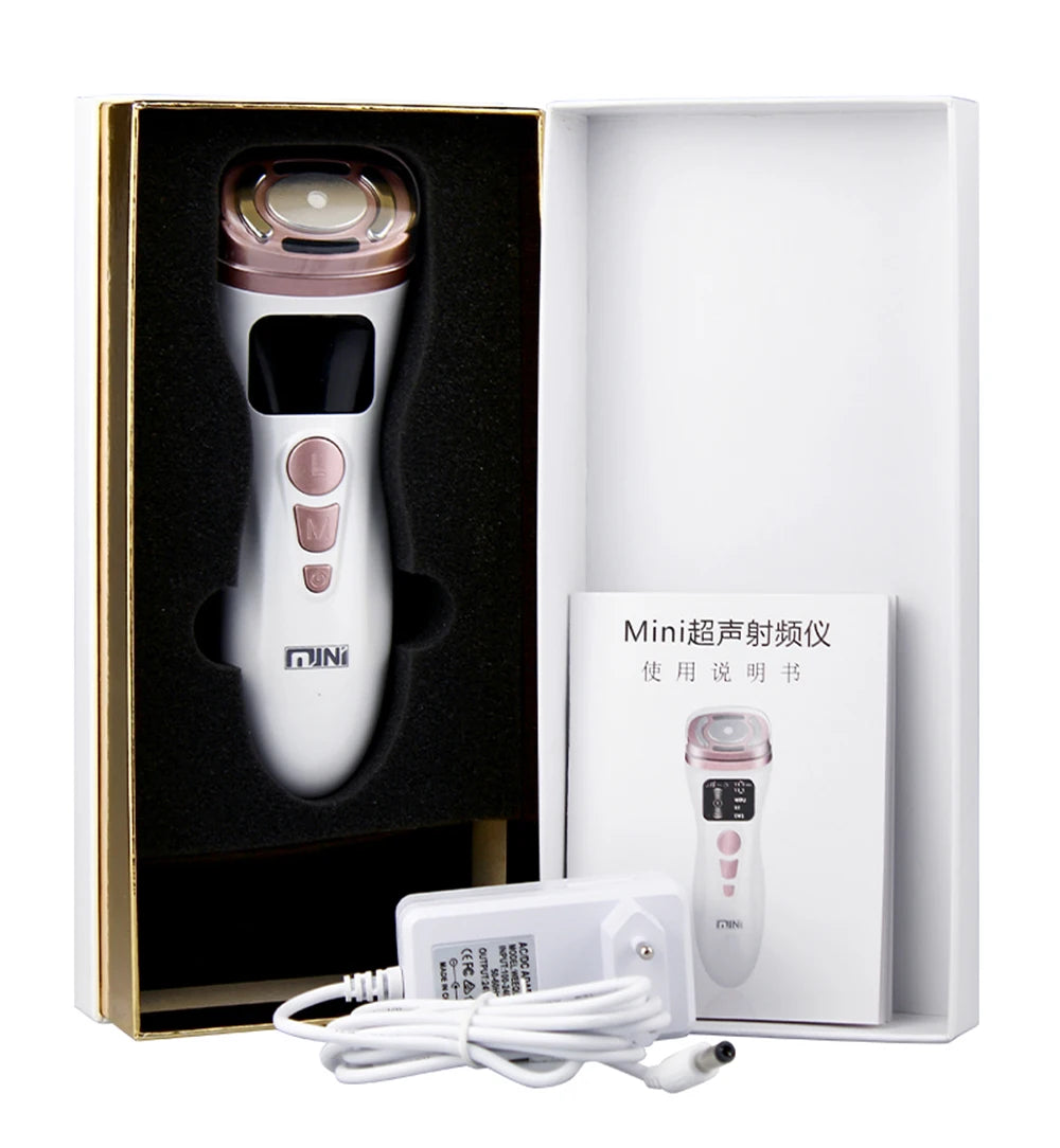 Mini HIFU facial device in white and rose gold, in a box with a user manual and power adapter.