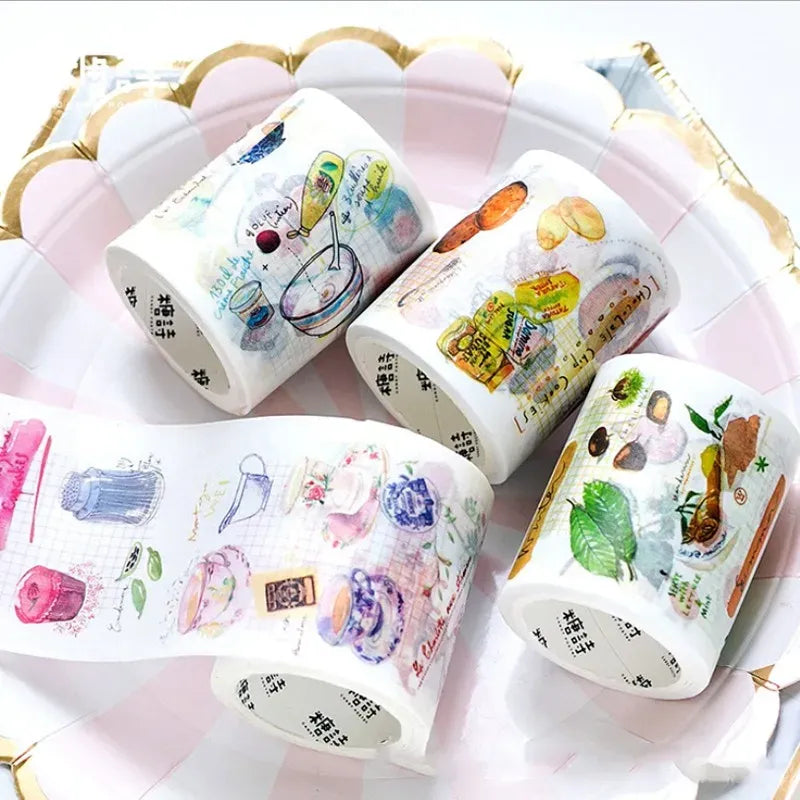 Food-themed masking tape rolls with cute animal-and-snack designs, white background
