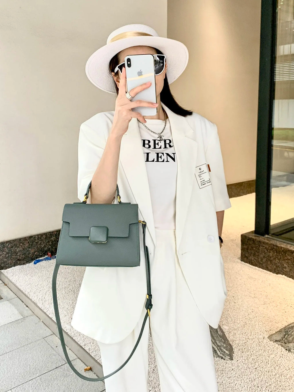 Sage green genuine leather designer handbag, structured shoulder tote with top handle and gold-tone hardware.