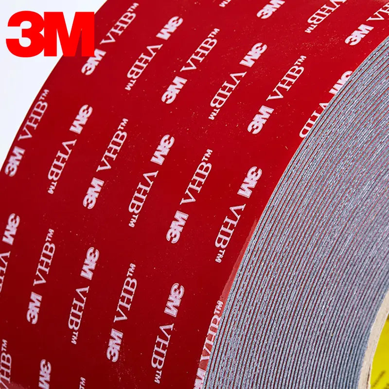 Red printed double-sided foam tape roll surface with gray backing edge