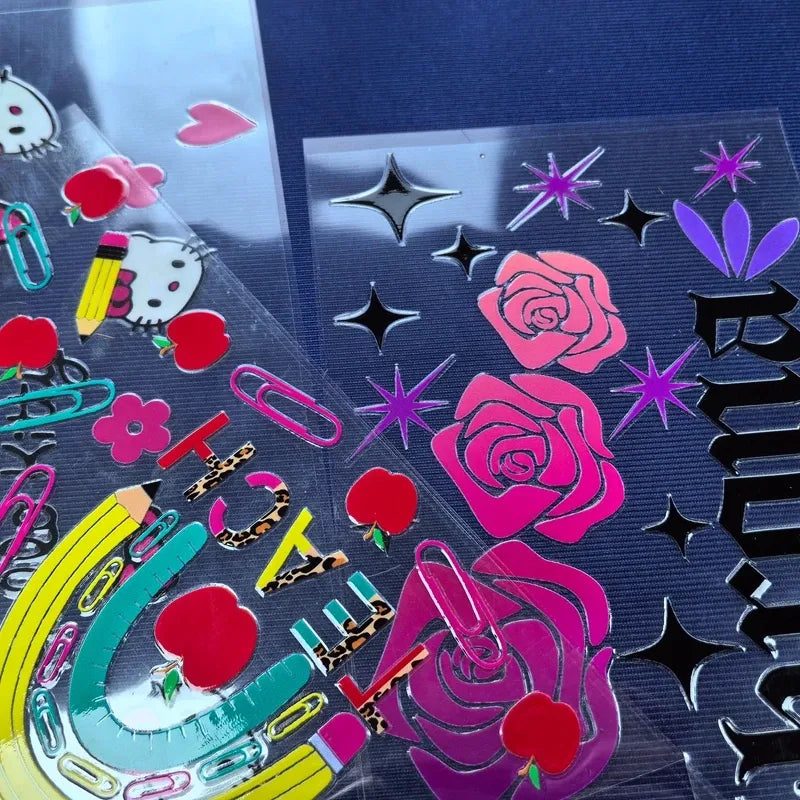 Vinyl die-cut sticker sheet with pink roses, hearts, sparkles, and starbursts