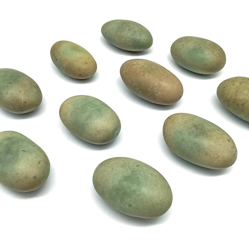 Assorted oval green crystal pebbles, smooth stones for landscaping and decor