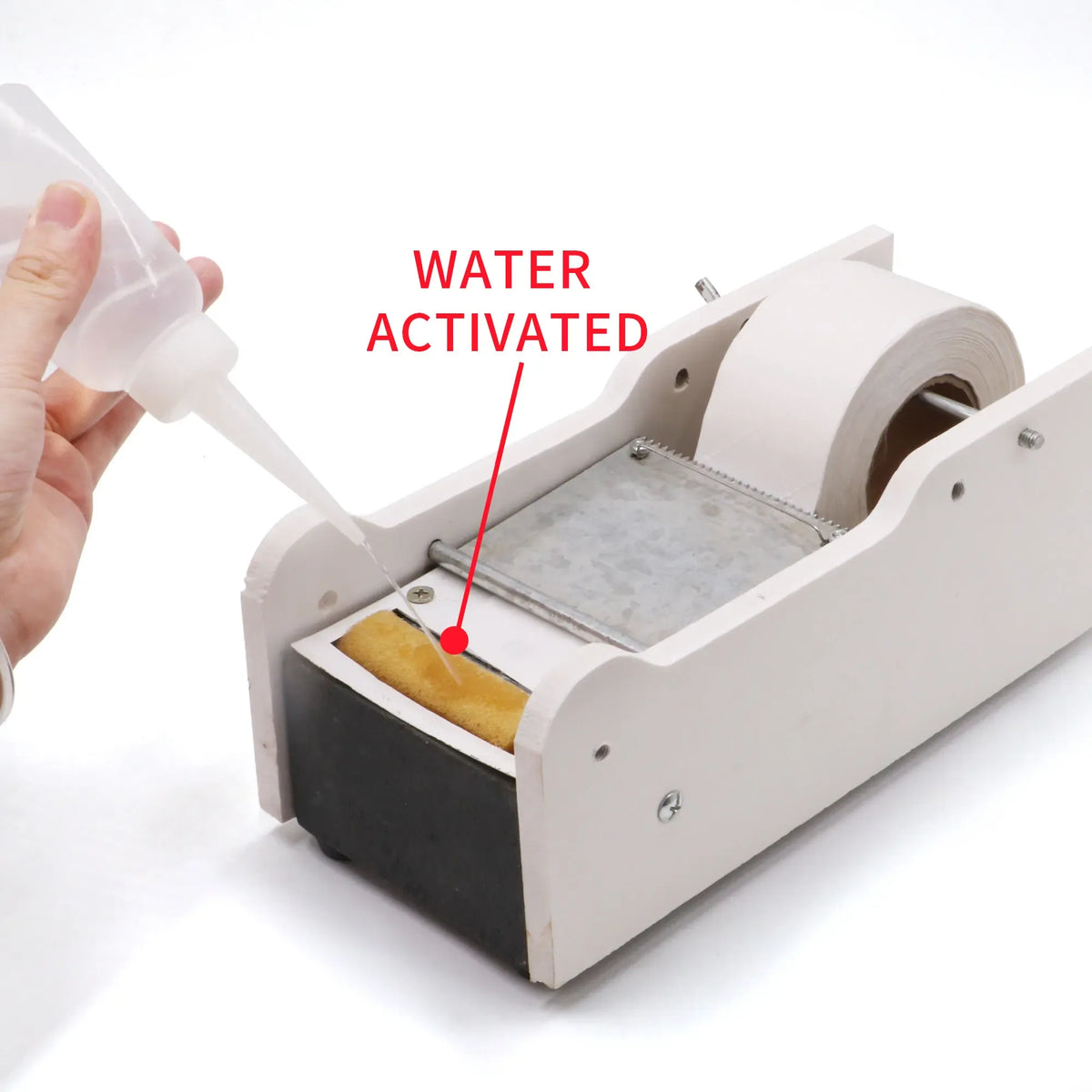 Water-activated kraft tape dispenser applying a white tape strip