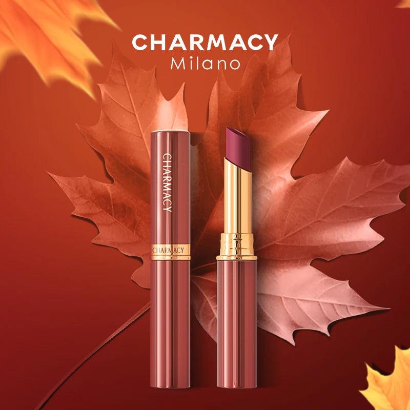 CHARMACY waterproof velvet matte lipstick in gold and rose casing, featured against autumn maple leaves.