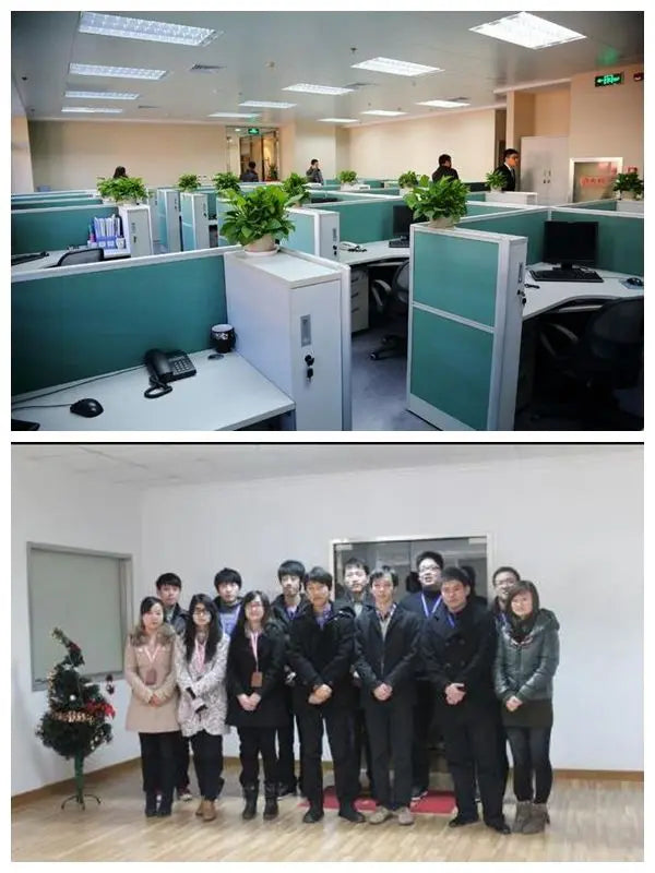 Office workspace desks and potted plants with people in background