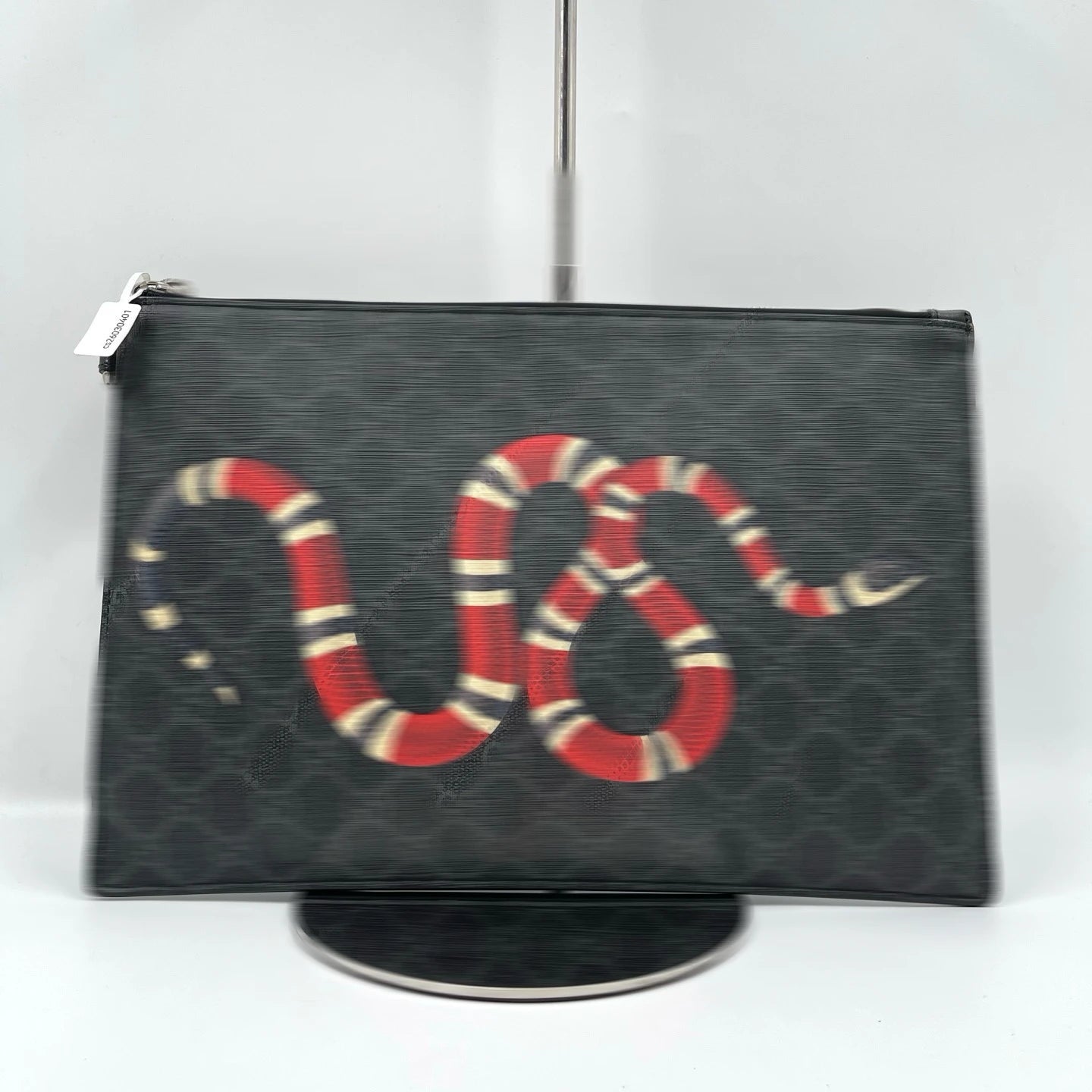 Second-hand designer black canvas clutch wallet featuring a stylish red, white, and black snake print, unisex style.