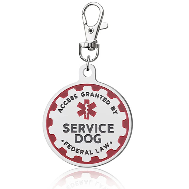 Durable red and white metal service dog ID tag with keychain clip for easy attachment to vests or collars.