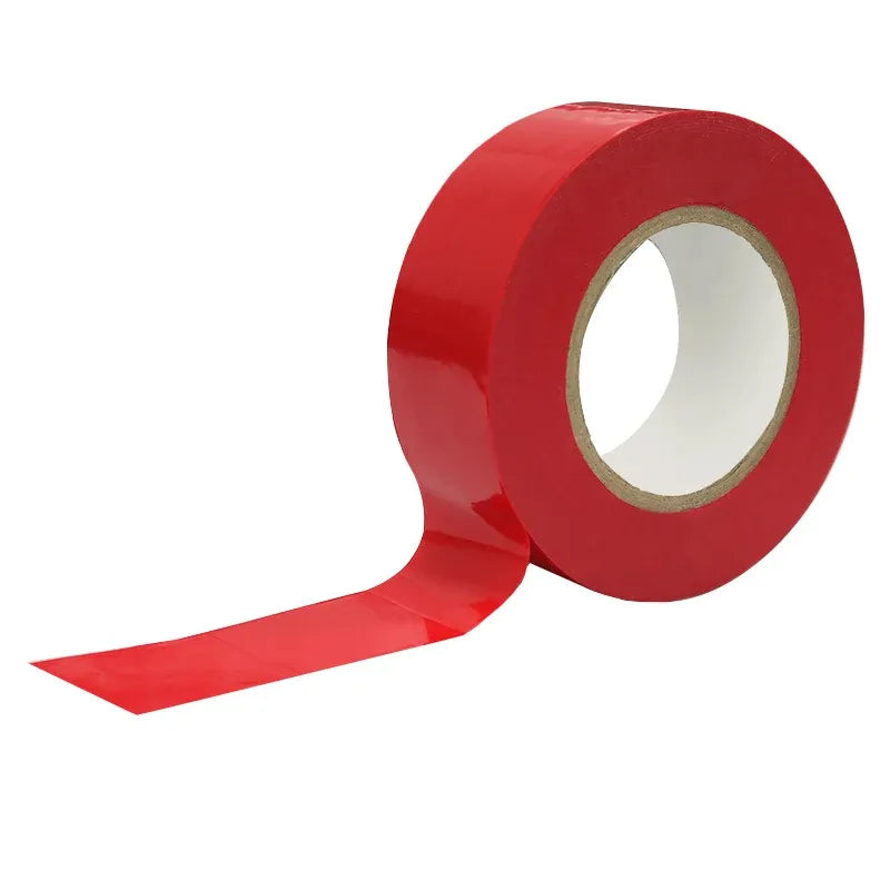 Red tape roll with a long strip of adhesive tape extending forward